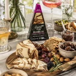 Balsamic Fig cashew cheese on a plate with accoutrement