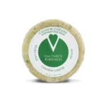 a 6.5oz package of vegan cashew based chevre with basil and chive by cultured kindness