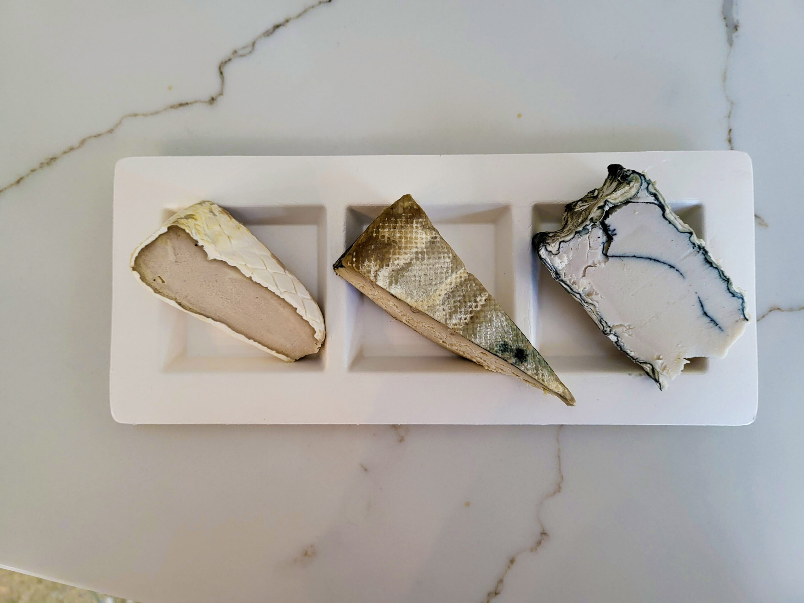 Premium aertisan vegan cheese including Rebel brie, Rind blue and Uncreamery ash brie