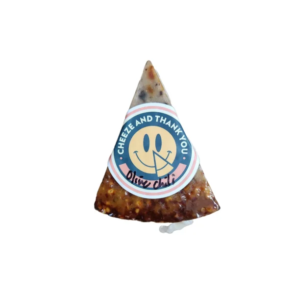 A packaged wedge of vegan soy based Olive Chili Pecorino by Cheeze and Thank You 5oz