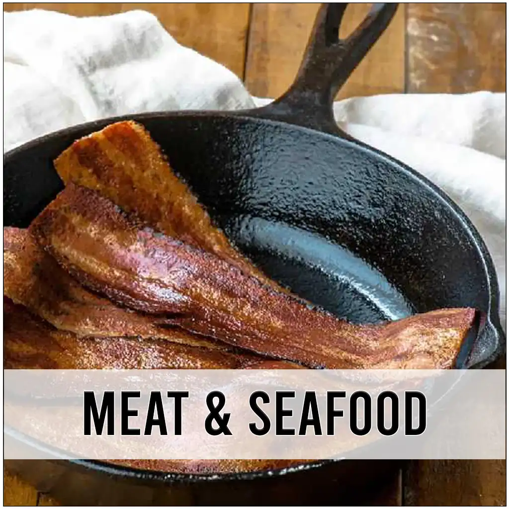 Vegan bacon in a pan with a white towel underneath on a wood table