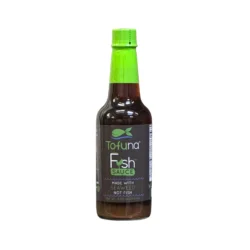 a bottle of vegan fish sauce on a white background