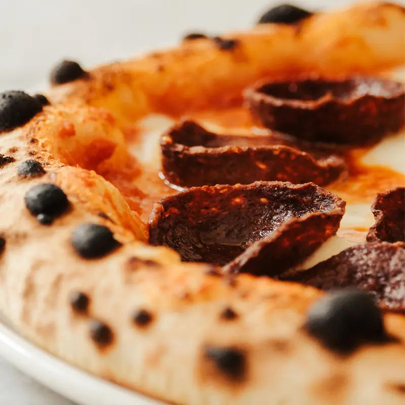 Vegan pepperoni pizza