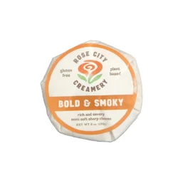 a packaged round of bold and smoky vegan cheese