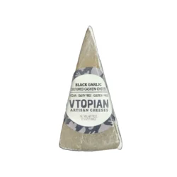 a package of black garlic vegan cheese on a white background