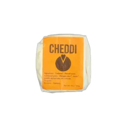 a package of cheddi vegan aged cheddar brie