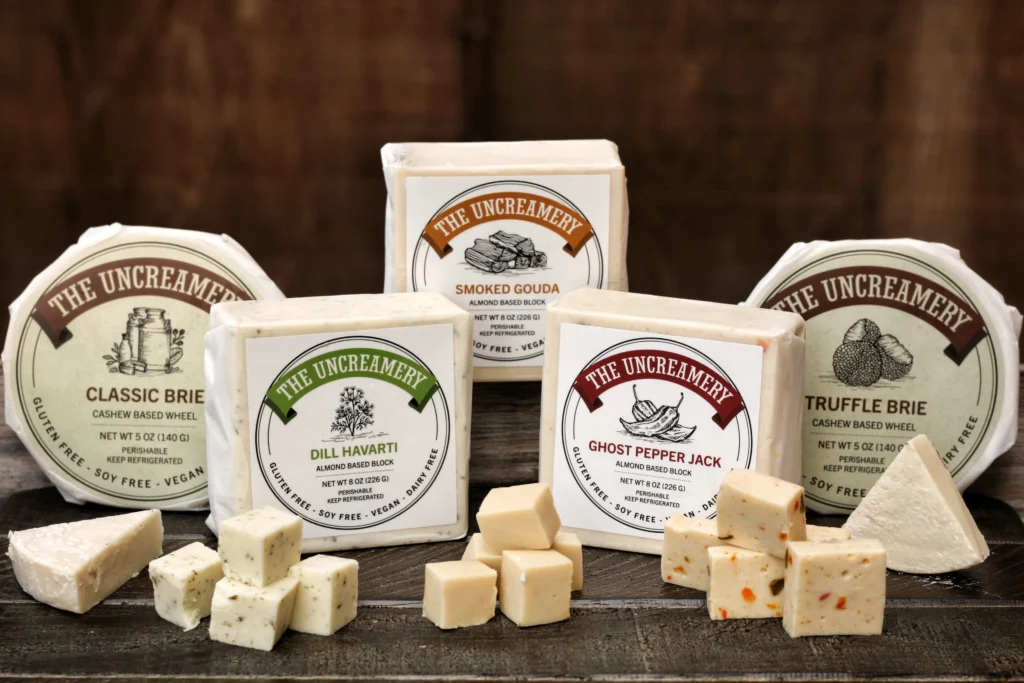 Five iconic plant based cheeses on display made by the artisanal vegan cheese maker The Uncreamery.