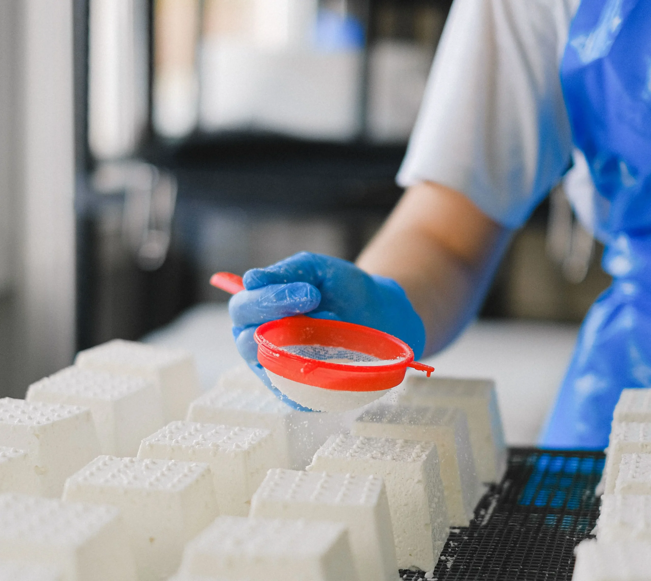 Person making cheese